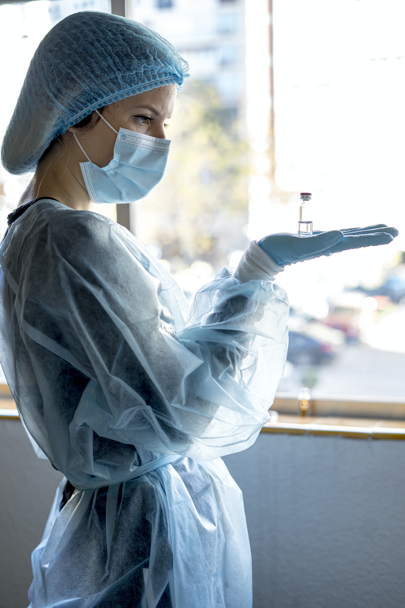 Doctor or laborant holding tube with nCoV Coronavirus vaccine for 2019-nCoV virus