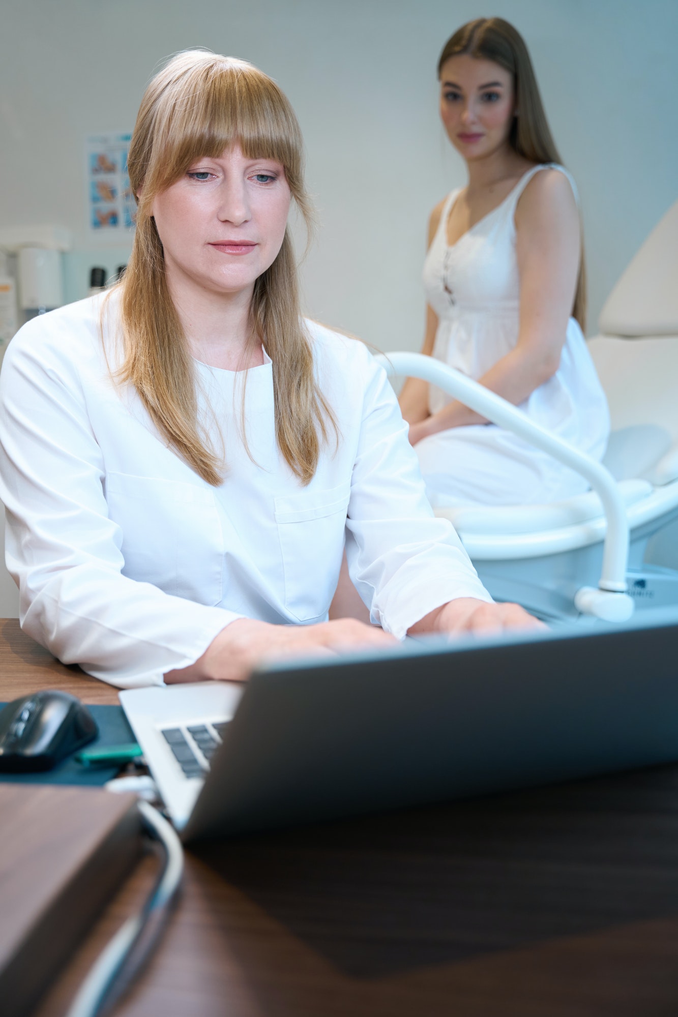 Young woman is consulted by a gynecologist